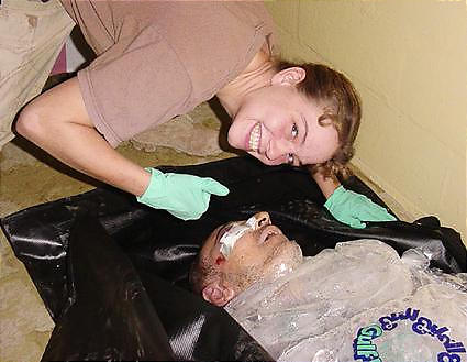 girl smiles over corpse.jpg